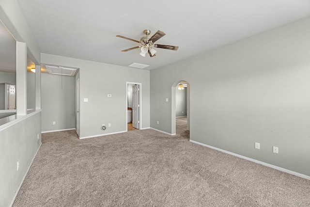 4810 Legends Bay Dr, Baytown, TX 77523 - unfurnished bedroom with attic access, arched walkways, baseboards, a spacious closet, and carpet flooring