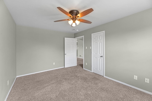 4810 Legends Bay Dr, Baytown, TX 77523 - unfurnished bedroom featuring carpet floors, baseboards, ceiling fan, and a closet