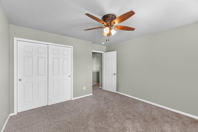 4810 Legends Bay Dr, Baytown, TX 77523 - unfurnished bedroom featuring carpet floors, baseboards, a ceiling fan, and a closet
