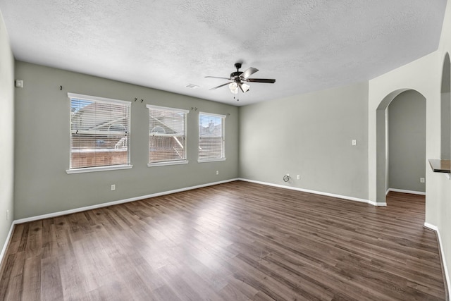 4810 Legends Bay Dr, Baytown, TX 77523 - spare room with arched walkways, a textured ceiling, and a ceiling fan