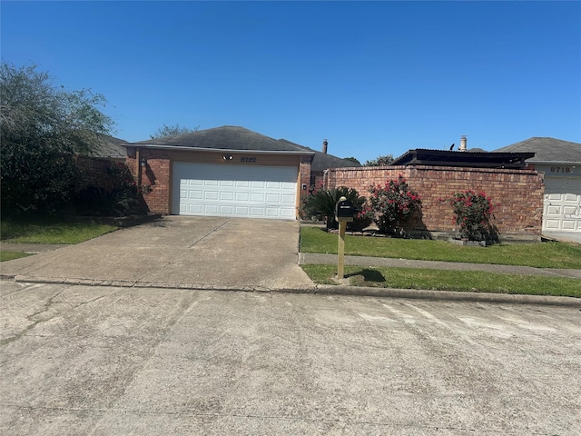 view of front of home with brick siding, concrete driveway, and a garage