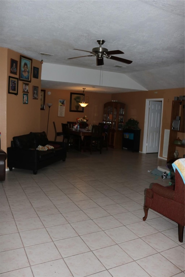 8722 Beau Monde Dr, Houston, TX 77099 - living room featuring ceiling fan, a textured ceiling, and light tile patterned flooring