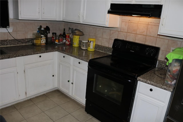 8722 Beau Monde Dr, Houston, TX 77099 - kitchen featuring electric range, extractor fan, white cabinetry, light tile patterned floors, and backsplash