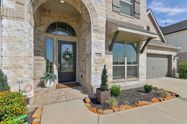 20618 Yearling Pasture Ln, Tomball, TX 77377 - doorway to property featuring driveway, brick siding, and stone siding