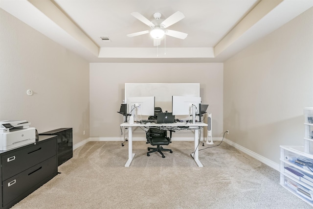 20207 Desert Foal Dr, Tomball, TX 77377 - home office featuring light colored carpet, a raised ceiling, ceiling fan, and baseboards