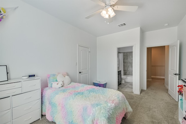 20207 Desert Foal Dr, Tomball, TX 77377 - bedroom with light carpet, baseboards, ensuite bathroom, and ceiling fan