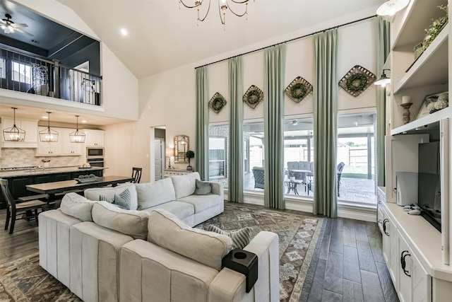 20207 Desert Foal Dr, Tomball, TX 77377 - living room with high vaulted ceiling, dark wood-style floors, and a chandelier