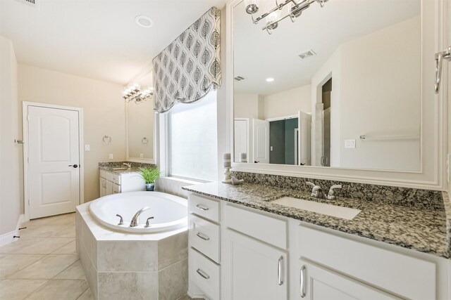 20207 Desert Foal Dr, Tomball, TX 77377 - full bathroom featuring a bath, tile patterned flooring, and two vanities