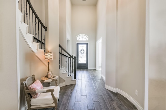 20207 Desert Foal Dr, Tomball, TX 77377 - foyer entrance featuring a towering ceiling, dark wood-style flooring, baseboards, and stairway