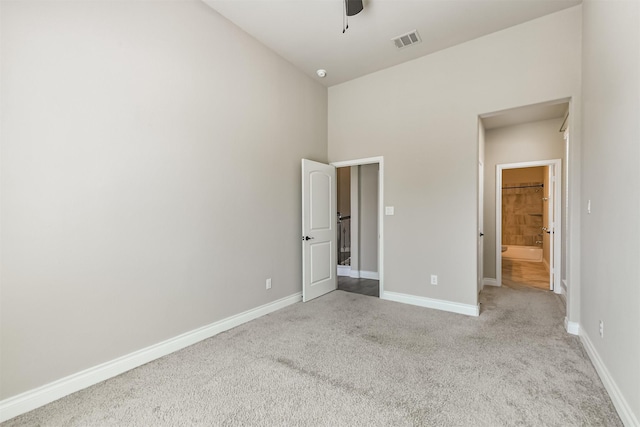 20207 Desert Foal Dr, Tomball, TX 77377 - unfurnished bedroom with carpet, baseboards, a high ceiling, and a ceiling fan