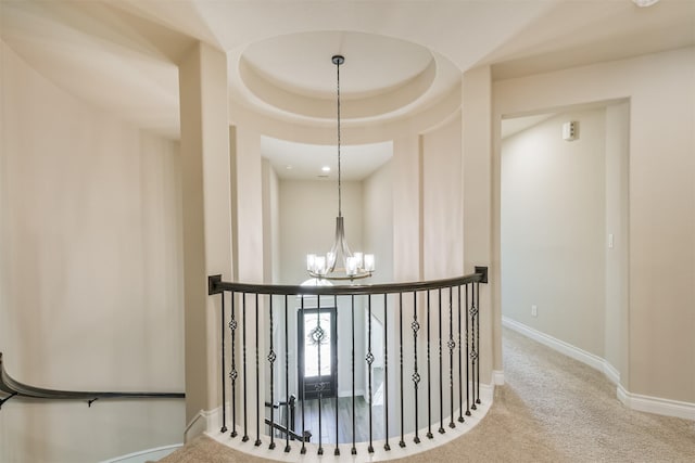 20207 Desert Foal Dr, Tomball, TX 77377 - hallway featuring a chandelier, an upstairs landing, carpet floors, and baseboards