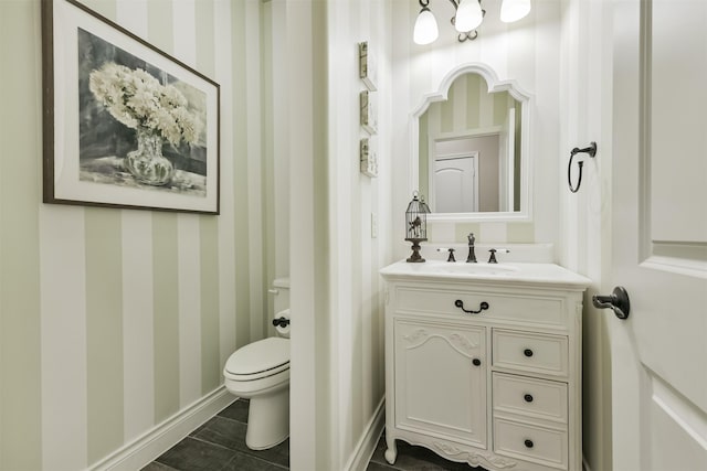 20207 Desert Foal Dr, Tomball, TX 77377 - half bath with wallpapered walls, vanity, toilet, and baseboards