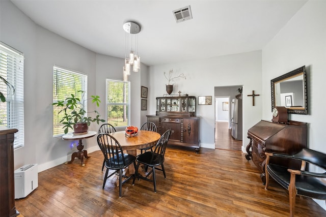 275 Pashun Ln, New Waverly, TX 77358 - dining room featuring baseboards, visible vents, and wood-type flooring