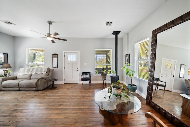 275 Pashun Ln, New Waverly, TX 77358 - living room with dark wood finished floors, visible vents, and plenty of natural light