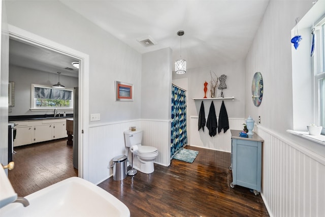 275 Pashun Ln, New Waverly, TX 77358 - full bath with visible vents, toilet, a sink, wainscoting, and hardwood / wood-style flooring