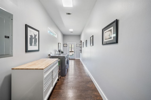 275 Pashun Ln, New Waverly, TX 77358 - hall featuring separate washer and dryer, electric panel, baseboards, dark wood-type flooring, and visible vents