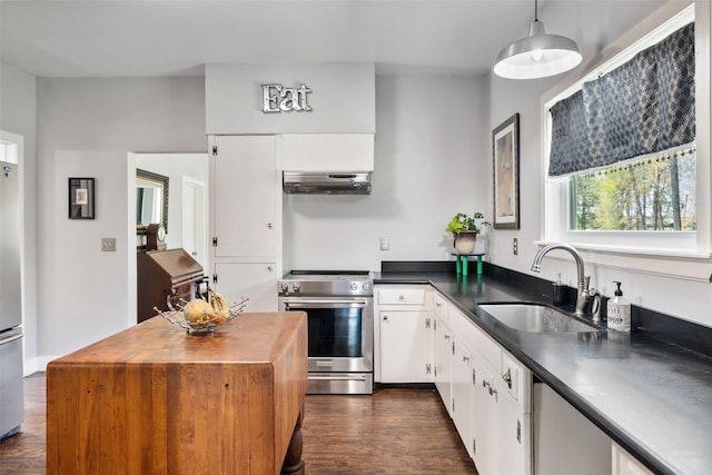 275 Pashun Ln, New Waverly, TX 77358 - kitchen featuring a sink, wooden counters, appliances with stainless steel finishes, white cabinets, and under cabinet range hood