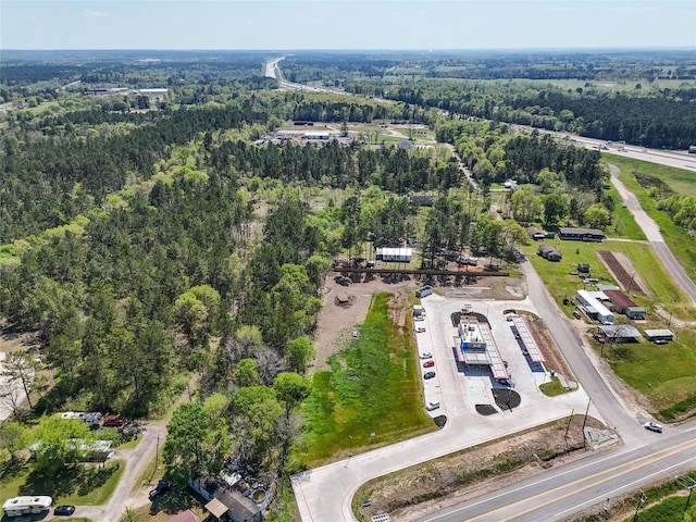 275 Pashun Ln, New Waverly, TX 77358 - drone / aerial view with a wooded view