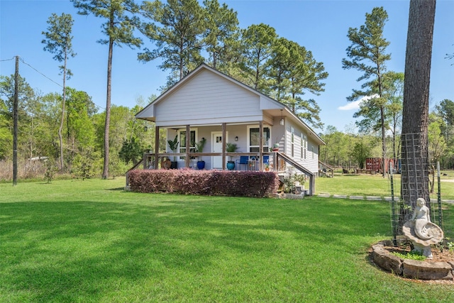 275 Pashun Ln, New Waverly, TX 77358 - back of property with a lawn and a porch