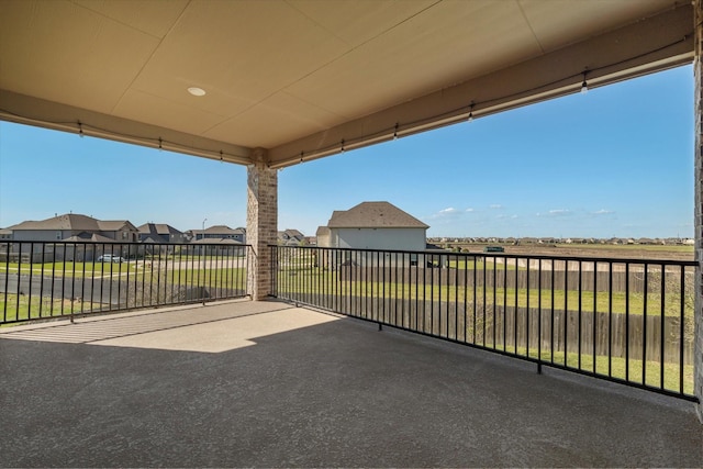 view of patio / terrace with a residential view and a balcony