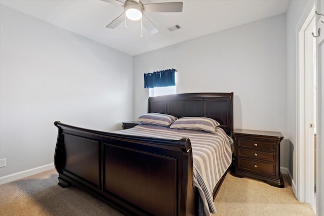 bedroom with light carpet, baseboards, ceiling fan, and visible vents