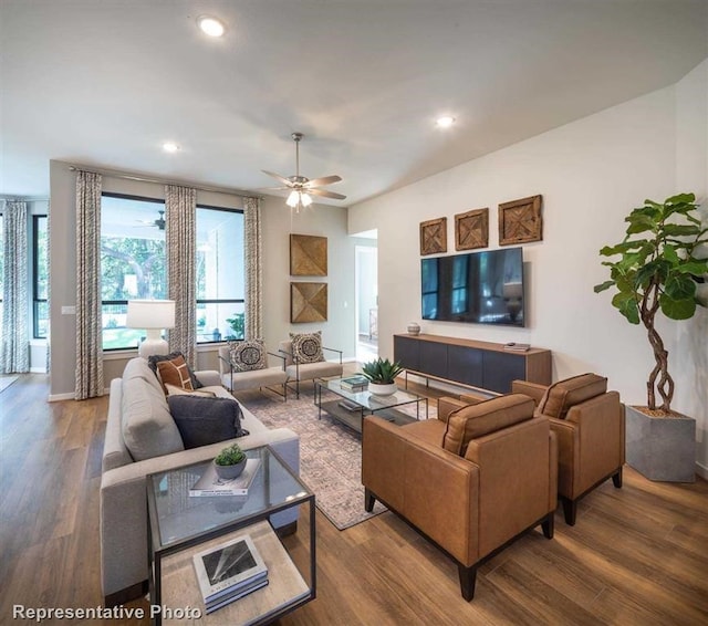 living room with baseboards, ceiling fan, recessed lighting, and wood finished floors
