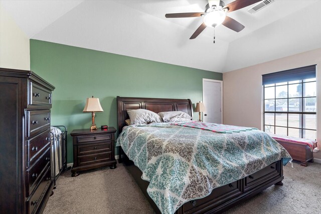 bedroom featuring vaulted ceiling, baseboards, carpet floors, ceiling fan, and visible vents