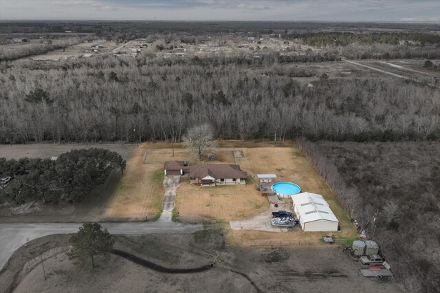 birds eye view of property with a rural view