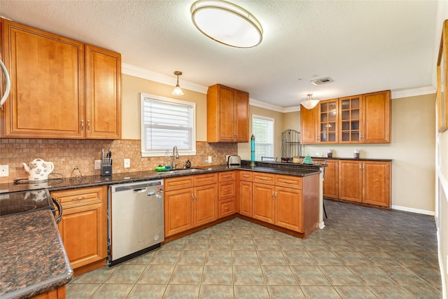 kitchen with a sink, visible vents, brown cabinetry, and dishwasher