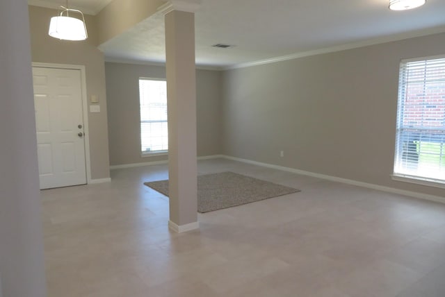 1606 Caslyn Dr, Rosenberg, TX 77471 - foyer entrance featuring plenty of natural light, crown molding, baseboards, and light floors