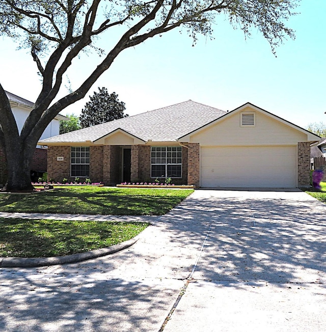1606 Caslyn Dr, Rosenberg, TX 77471 - ranch-style home with brick siding, an attached garage, concrete driveway, and a front yard