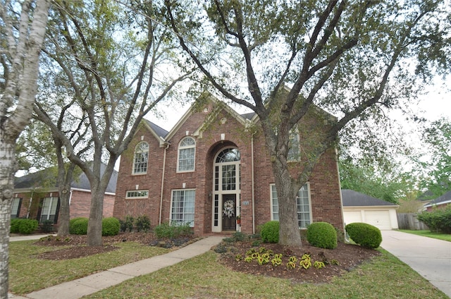 4242 Noble Oak Trl, Houston, TX 77059 - traditional-style home with brick siding and a detached garage