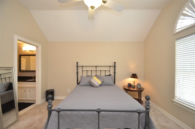 4242 Noble Oak Trl, Houston, TX 77059 - bedroom featuring vaulted ceiling, light carpet, ensuite bath, baseboards, and a ceiling fan