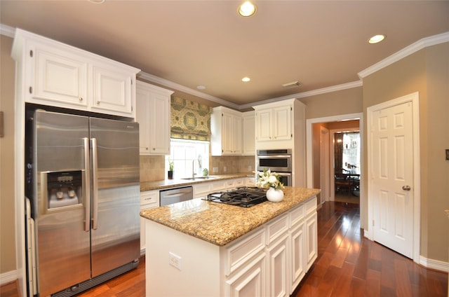4242 Noble Oak Trl, Houston, TX 77059 - kitchen with stainless steel appliances, a sink, light stone countertops, tasteful backsplash, and white cabinetry