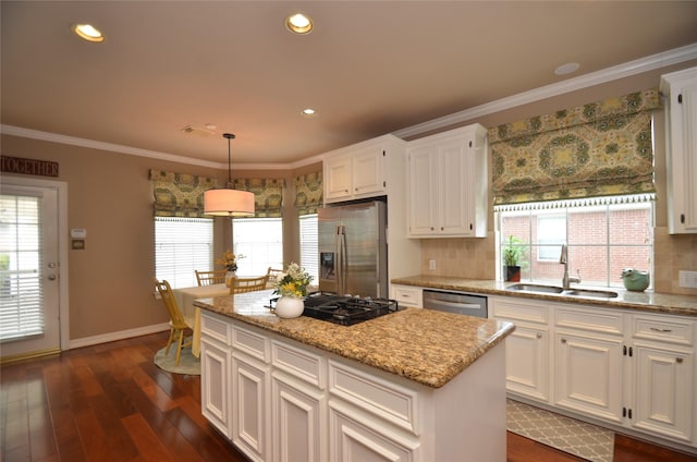 4242 Noble Oak Trl, Houston, TX 77059 - kitchen featuring appliances with stainless steel finishes, a sink, decorative backsplash, baseboards, and white cabinets