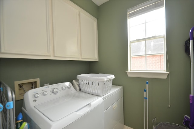 4242 Noble Oak Trl, Houston, TX 77059 - clothes washing area with washer and dryer and cabinet space