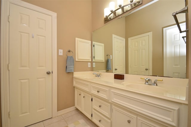 4242 Noble Oak Trl, Houston, TX 77059 - bathroom with tile patterned floors, double vanity, and baseboards
