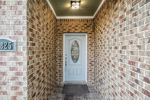 property entrance with brick siding