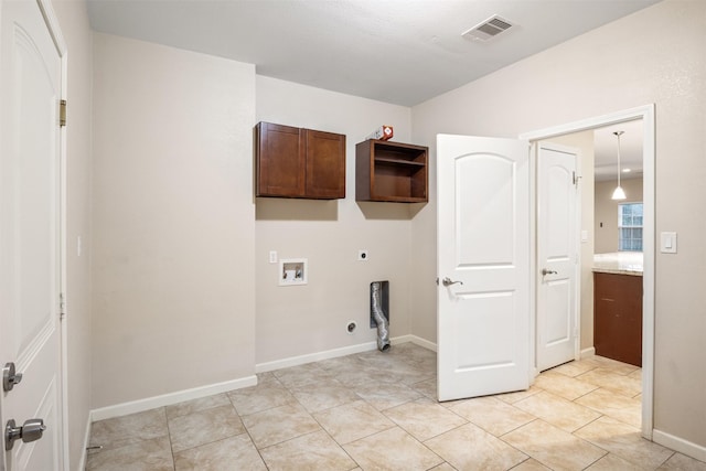 washroom with hookup for a washing machine, baseboards, visible vents, electric dryer hookup, and laundry area