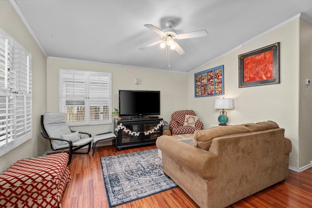 living room featuring crown molding, a ceiling fan, wood finished floors, and lofted ceiling