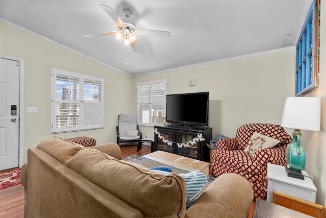 living room featuring crown molding, a ceiling fan, wood finished floors, and lofted ceiling