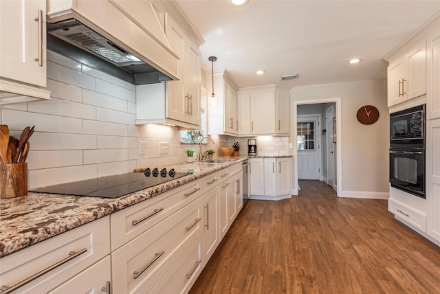 1811 Hunt Dr, Friendswood, TX 77546 - kitchen with a sink, white cabinetry, wood finished floors, premium range hood, and black appliances