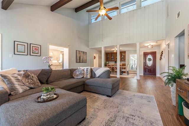 1811 Hunt Dr, Friendswood, TX 77546 - living room featuring visible vents, beamed ceiling, baseboards, ceiling fan, and wood finished floors