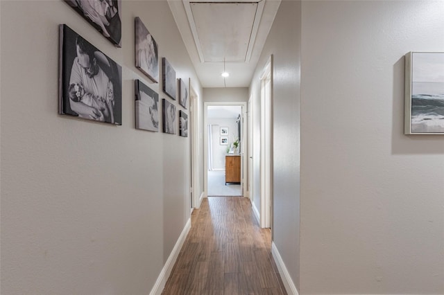 1811 Hunt Dr, Friendswood, TX 77546 - hall featuring baseboards, attic access, and wood finished floors