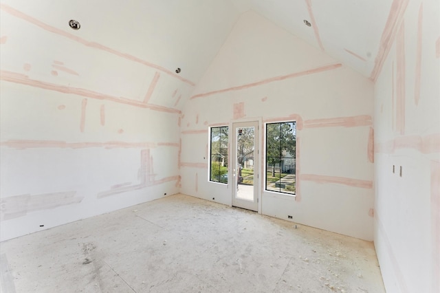 spare room with lofted ceiling