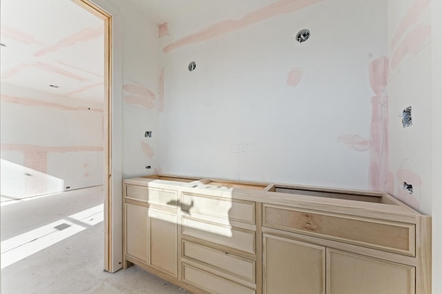 bathroom featuring unfinished concrete flooring