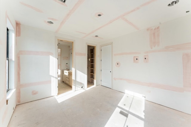 unfurnished room featuring plenty of natural light