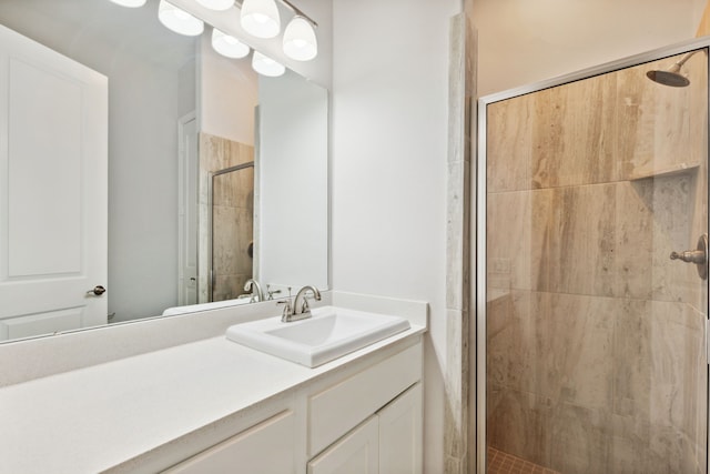 bathroom with vanity and a stall shower