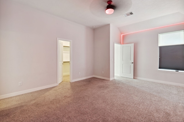 carpeted empty room with baseboards and visible vents