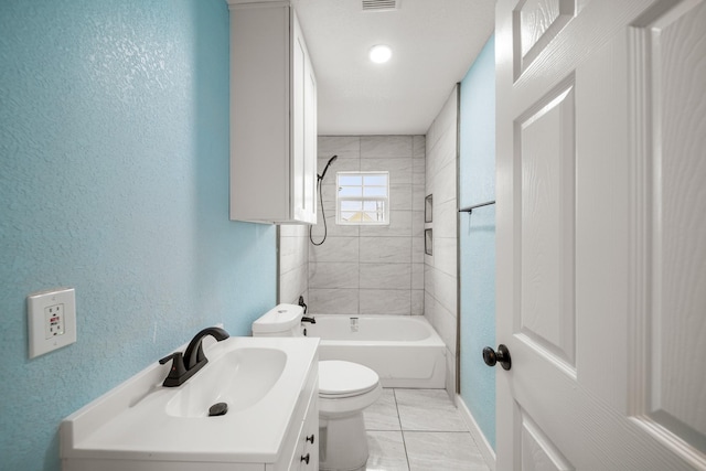 full bathroom with toilet, a textured wall, baseboards, and vanity